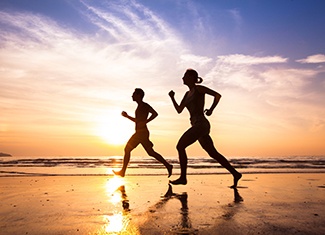 Couple jogging outside, leading healthy lifestyle